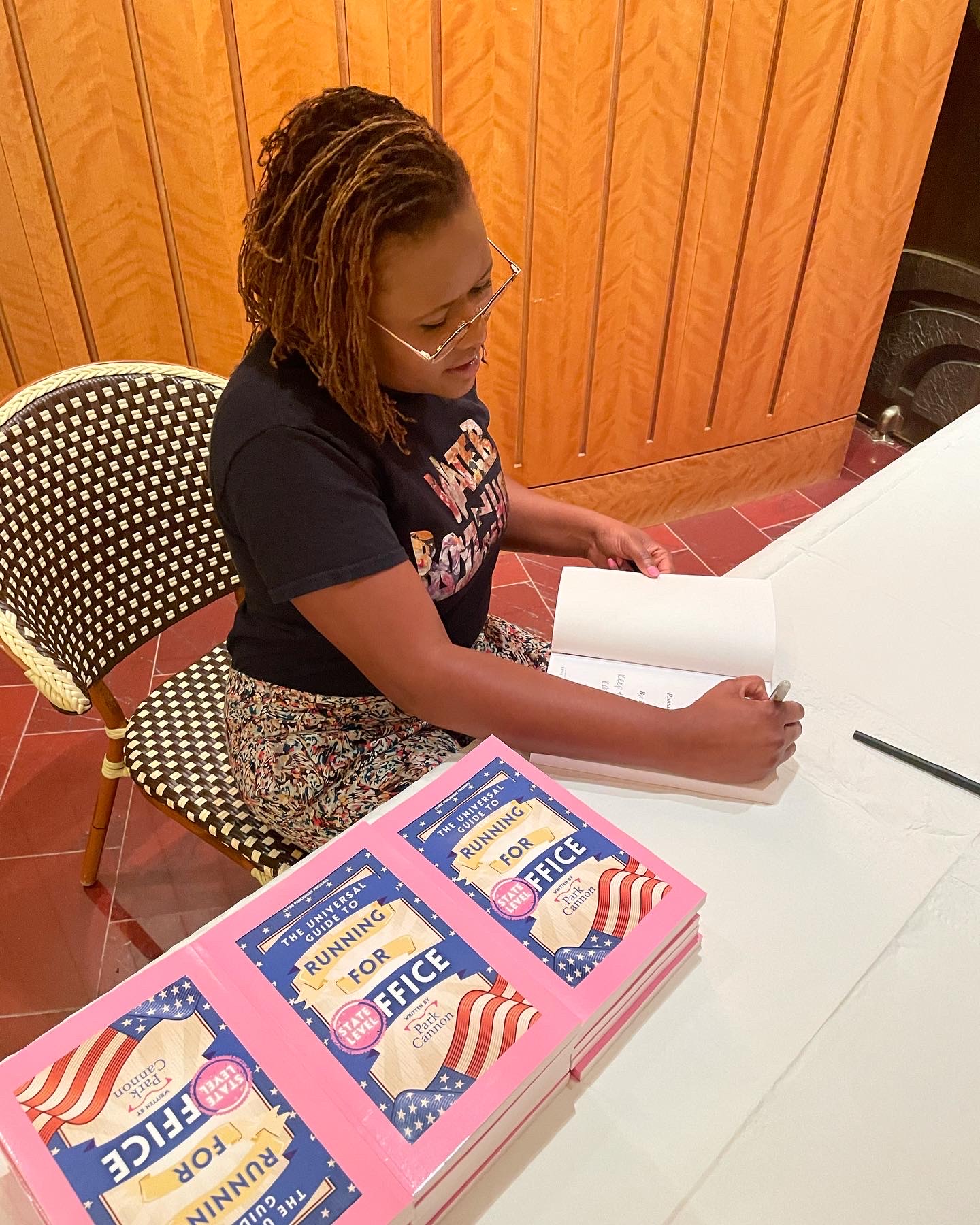 Park Cannon signing books at an event